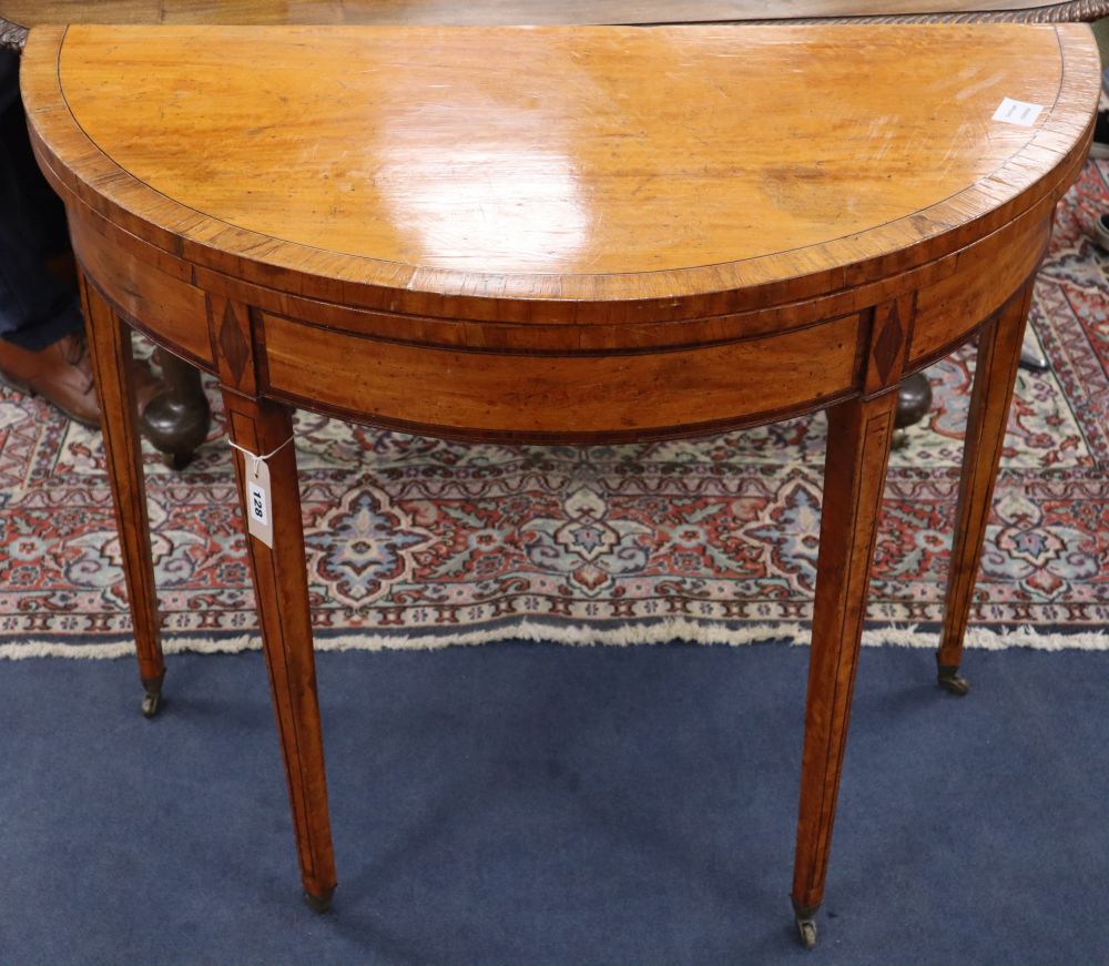 A George III satinwood and rosewood banded demi lune card table, W.92cm, D.55cm, H.76cm